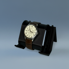Support de montre SKÅDIS noir avec montre à bracelet cuir marron posée dessus